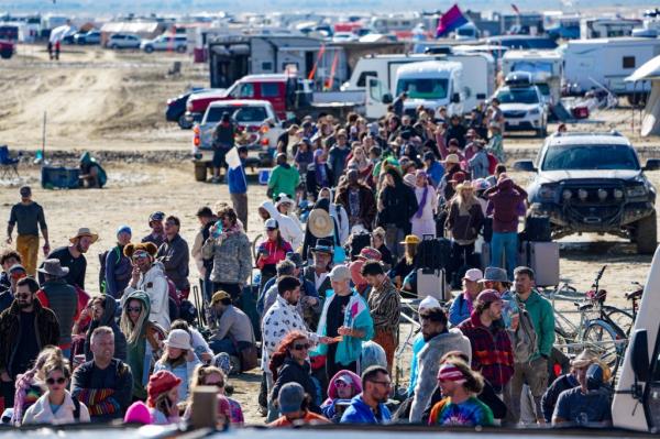 Hundreds of Burning Man attendees who planned to leave on buses wait for information a<em></em>bout when they will be able to leave on Labor Day.