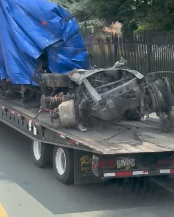 The wreckage of the truck was pulled out of the collapsed overpass. 