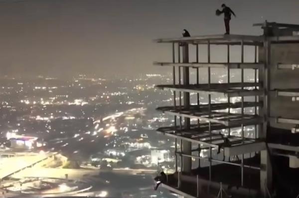 Parachuter on top of the building.