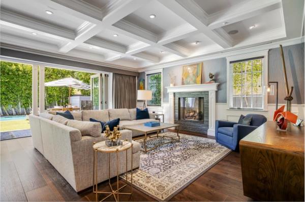 The living room with coffered ceilings.
