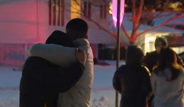 Neighbors outside of the house after the shooting.