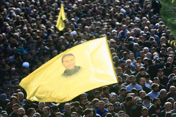 People attend a funeral of a Hezbollah military member killed in an Israeli airstrike on Tuesday.