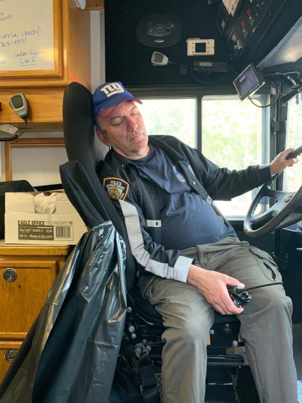 Photo of police boss sleeping in police vehicle.