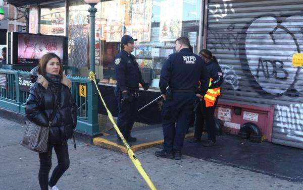 Cops at the scene of the entrance after the car was removed