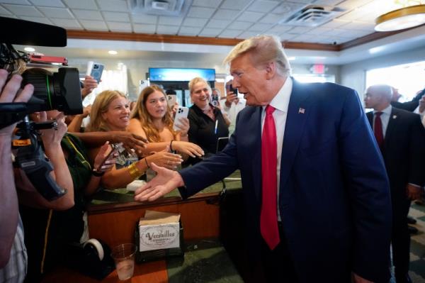 Trump greeting supporters at the famous Little Havana restaurant.
