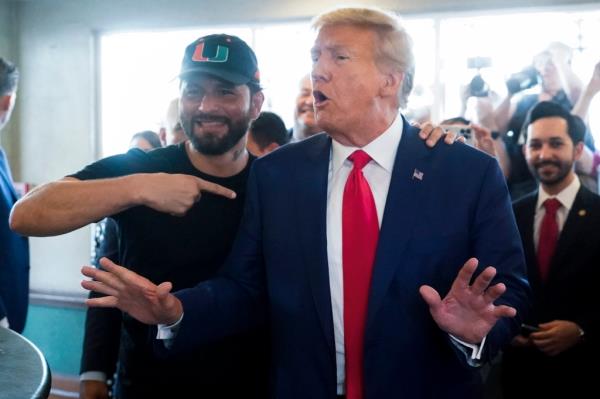 Trump posing with former MMA fighter Jorge Masvidal.