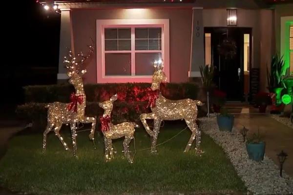 Around 3:42 a.m., Elvin's Ring camera captured the black bear curiously approaching three lit-up reindeer Christmas decorations