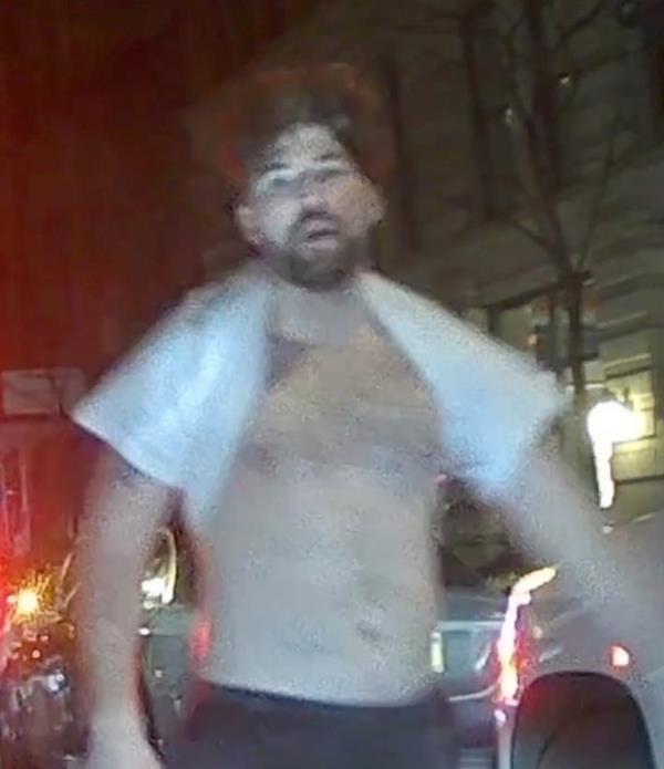 A shirtless Jo<em></em>nathan Maimon leaves the scene after a brutal assault.