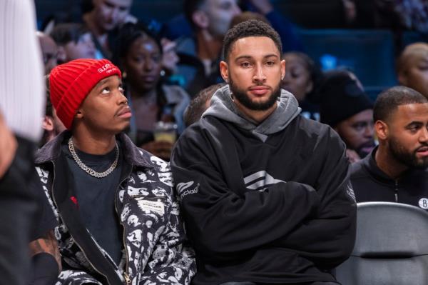 Brooklyn Nets guard Ben Simmons, right, looks on in the first half against the Detroit Pistons at Barclays Center, Saturday, Dec. 23, 2023