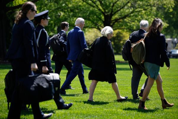 President Joe Biden (4th L) is accompanied by Deputy Chief of Staff Bruce Reed (3rd L), senior advisors Anita Dunn (5th L) and Mike Do<em></em>nilon (2nd R) as they depart the White House on April 23, 2024.
