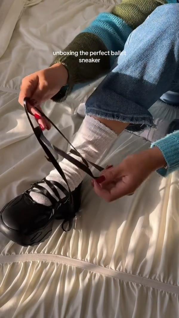 A person tying the laces of fashio<em></em>nable ballet sneakers.