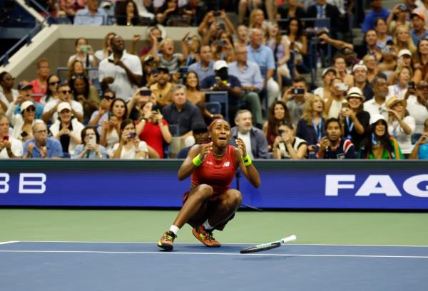 Gauff falls to the court full of emotion after she defeats Aryna Sabalenka.