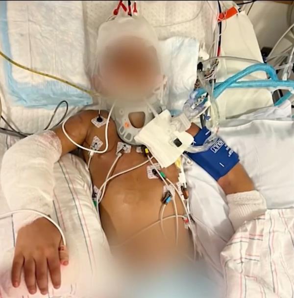Jaevion Riley in a hospital bed.