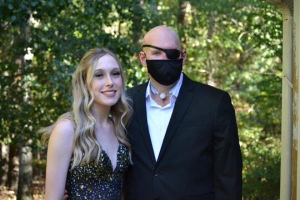 Mr James pictured with his daughter Allie in September 2022 before he had facial reco<em></em>nstruction surgery (Picture: AP)