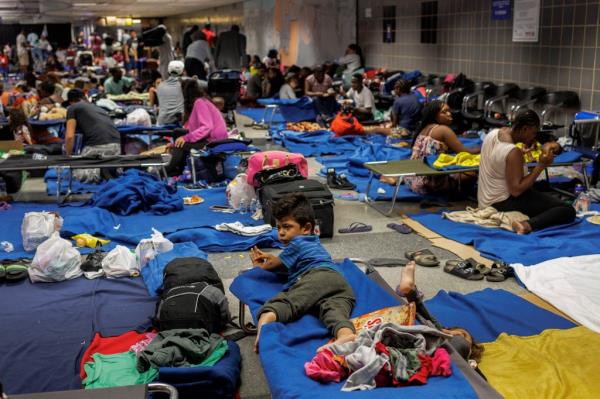 Terminals in both Chicago's airports have been co<em></em>nverted into makeshift migrant shelters are tent cities are erected