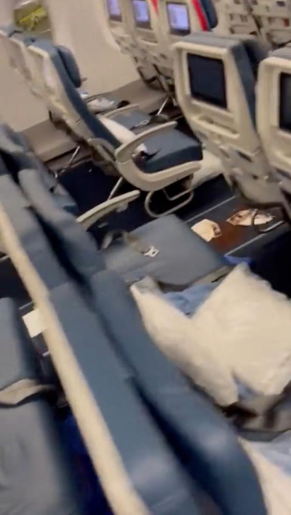 A screen grab from the video shows paper towels trying to cover up the mess.