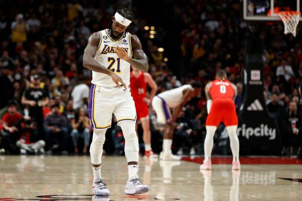 Patrick Beverley #21 of the Los Angeles Lakers mimics Damian Lillard's 