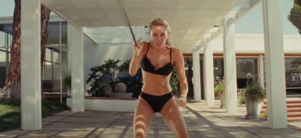 Miley Cyrus working out in a music video 