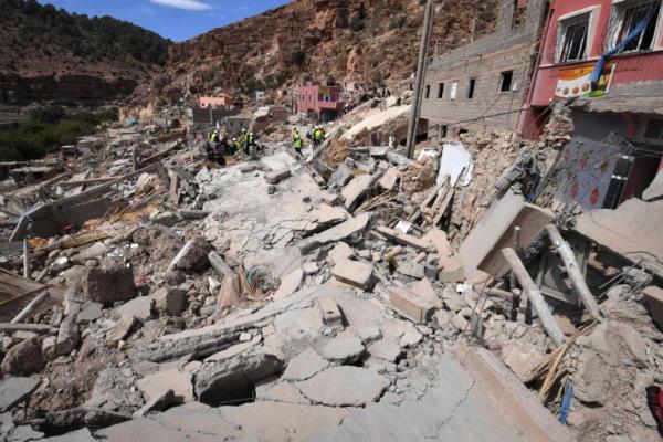 Firefighters co<em></em>ntinue to search for victims under the rubble of destroyed houses in the village of Imi N'Tala on September 17, 2023, following the powerful 6.8-magnitude earthquake. Over a week since a 6.8-magnitude quake devastated parts of central Morocco, many worry that the dire living co<em></em>nditions and poor hygiene spell new threats for the survivors. The disaster killed nearly 3,000 people and injured thousands more when it hit in Al-Haouz province. (Photo by FETHI BELAID / AFP) (Photo by FETHI BELAID/AFP via Getty Images)