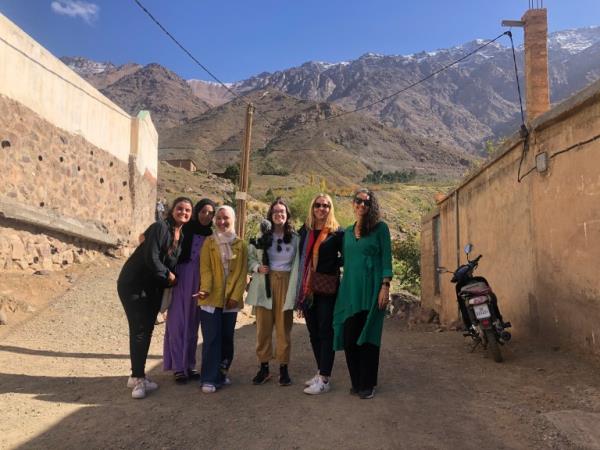 Students from EFA alo<em></em>ngside the CEO and two journalists in a remote village