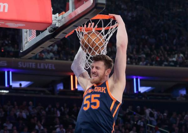 New York Knicks center Isaiah Hartenstein #55 slams the ball during the first quarter.
