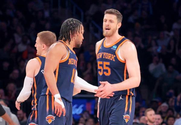 Jalen Brunson #11 of the New York Knicks greets Isaiah Hartenstein #55 of the New York Knicks during the first quarter.