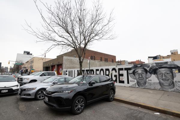 Cars parked outside of the firehouse on East 124th Street and 3rd Avenue