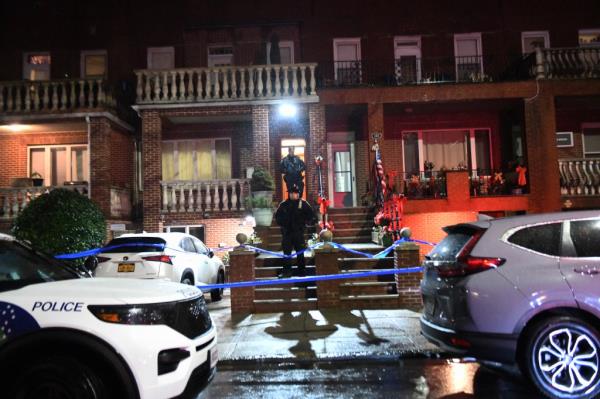 Police officer leaving home wher<em></em>e woman was killed.