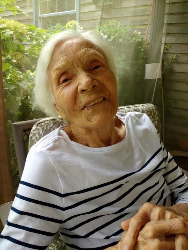 Chodowiec, with grey hair in a white shirt with thin navy stripes, lookign at the camera