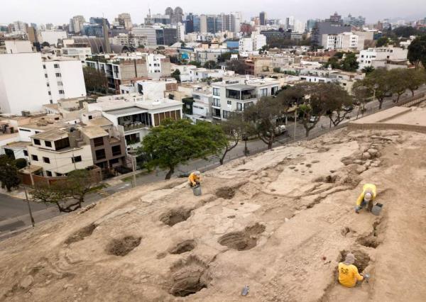 Workers excavating in the Huaca (Sanctuary) Pucllana, in the heart of a residential area in the district of Miraflores in Lima