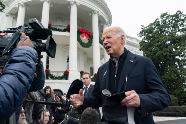 President Joe Biden speaks to members of the media as he leaves the White House to spend the Christmas holiday with his family at Camp David presidential retreat, near Thurmont, Md., Saturday, Dec. 23, 2023.
