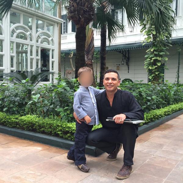 Daniel Garcia Carerra with his son Lucas, in a garden courtyard