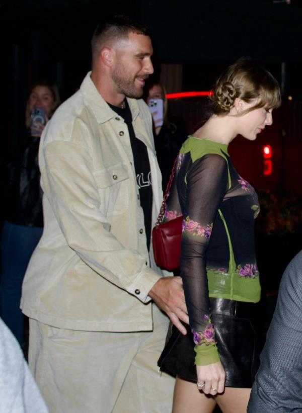 Kelce was beaming as the pair held hands while exiting the hotel.
