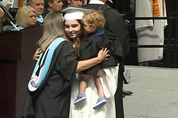 Landry was received on stage with a welcoming handshake and a hug, and Grayson even earned himself a pat on the head.
