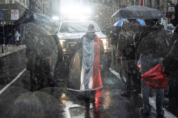 Protesters blocking an NYPD vehicle in Times Square.