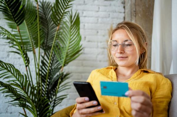 Woman on phone with credit card