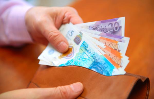 UK pound notes in wallet