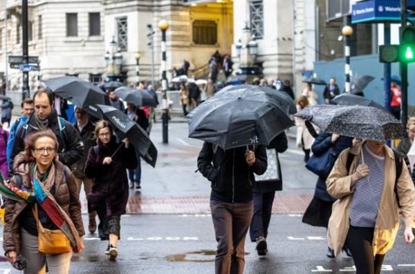 Mandatory Credit: Photo by Alex Lentati/LNP/Shutterstock (14193761d) Commuters brave the wind and rain at Waterloo Station Lo<em></em>ndon this morning as weather forecasters predict a windy day with heavy rain and winds speeds excess of 40mph for Lo<em></em>ndon and the South East. More unsettled weather is expected for Lo<em></em>ndon and the South East, London, UK - 08 Nov 2023