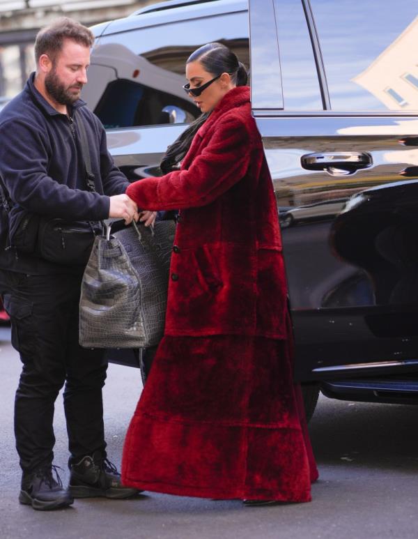Kim Kardashian do<em></em>nned a big red fur back in December on the set of 