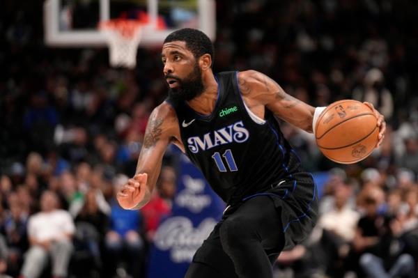 Mavericks guard Kyrie Irving works against the New Orleans Pelicans