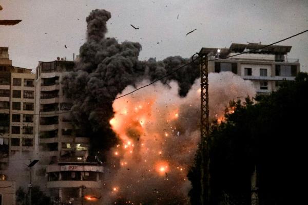 A fireball erupts from the site of an Israeli airstrike that targeted the area of Tayouneh in Beirut's southern suburbs on Nov. 25, 2024.