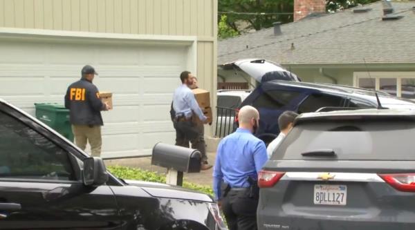 FBI agents removing boxing from the mayor's Oakland home.