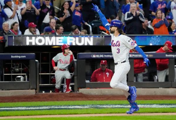A photo of Mets player Jesse Winker as he heads for home following a home run he hit at Citi Field against the Philadelphia Phillies.