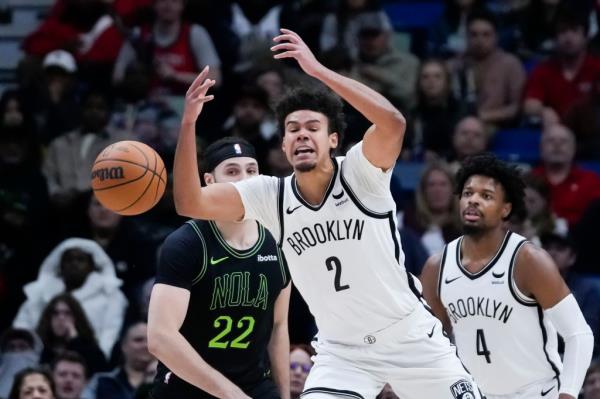 Brooklyn Nets forward Cameron Johnson (2) loses the ball in the second half of an NBA basketball game against the New Orleans Pelicans in New Orleans, Tuesday, Jan. 2, 2024.