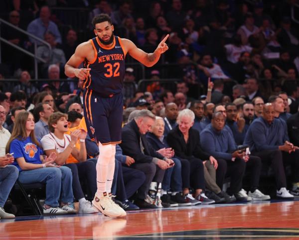 Karl-Anthony Towns #32 of the New York Knicks reacts after hitting a shot.