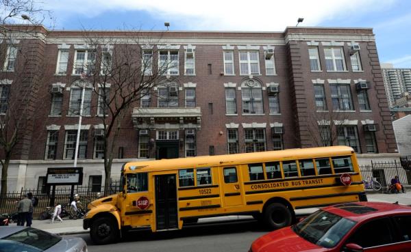 Overcrowded Brooklyn Public School 8, with parents applying for Pre-K and K spots via lottery, and a school bus parked in front.