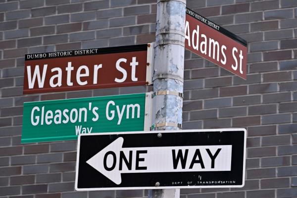The street signs at the intersection of Water and Adams Street