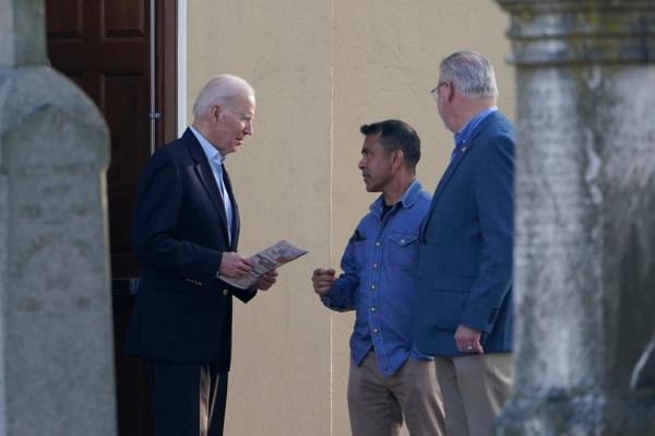 President Joe Biden speaks with Anthony Bernal outside St. Joseph on the Brandywine Catholic Church in Wilmington, Delaware.