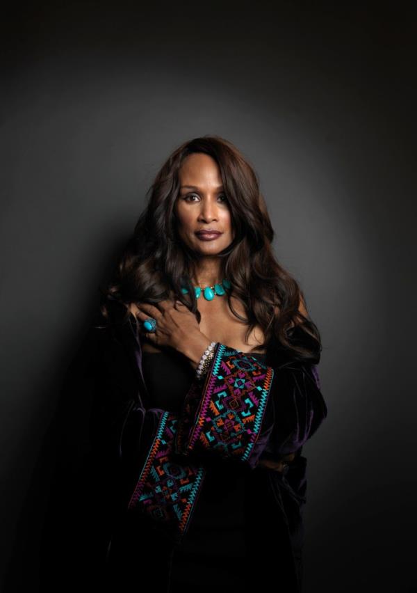 Beverly Johnson against black backdrop