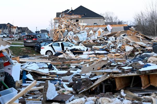 Debris covers the area around homes destroyed in the West Creek Farms 